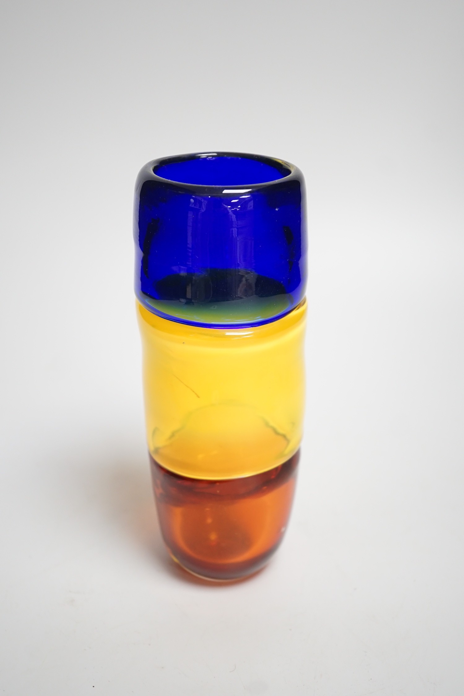 A signed Mike Frolich fused three colour glass vase. 19cm high